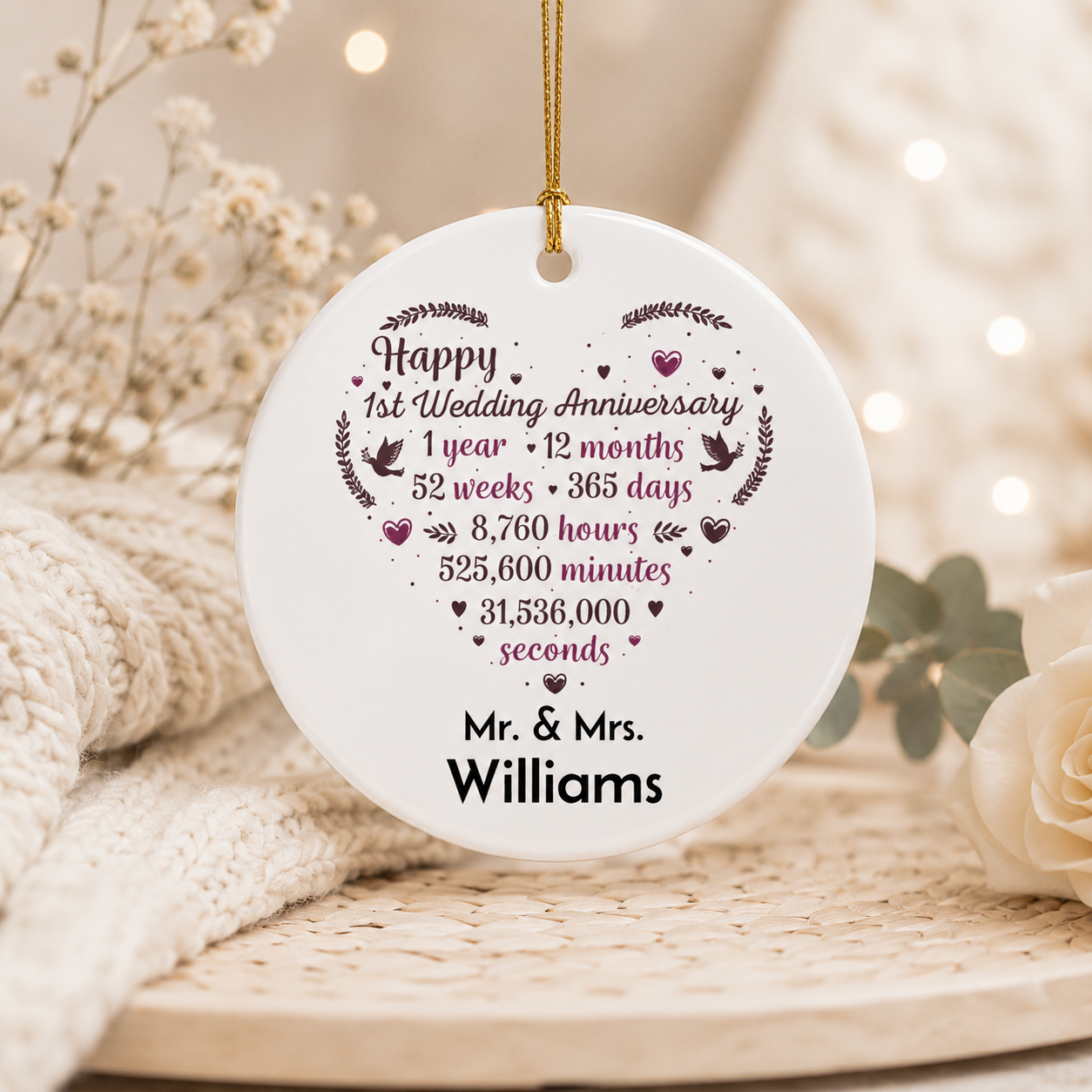 First anniversary ornament personalised with surname — round ceramic keepsake with gold hanging string