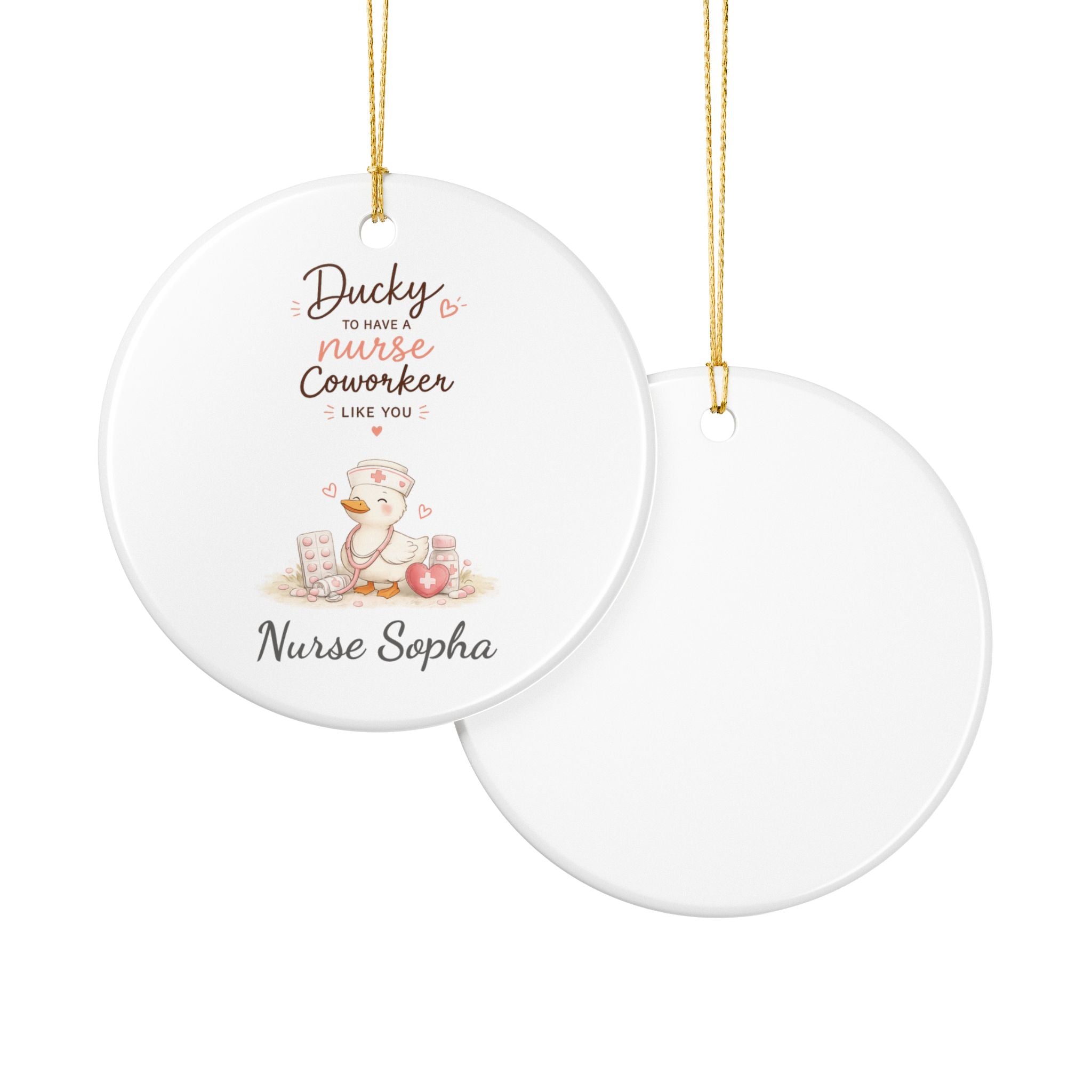 Ducky nurse ornament lifestyle shot — round white ceramic nurse gift with gold hanging string