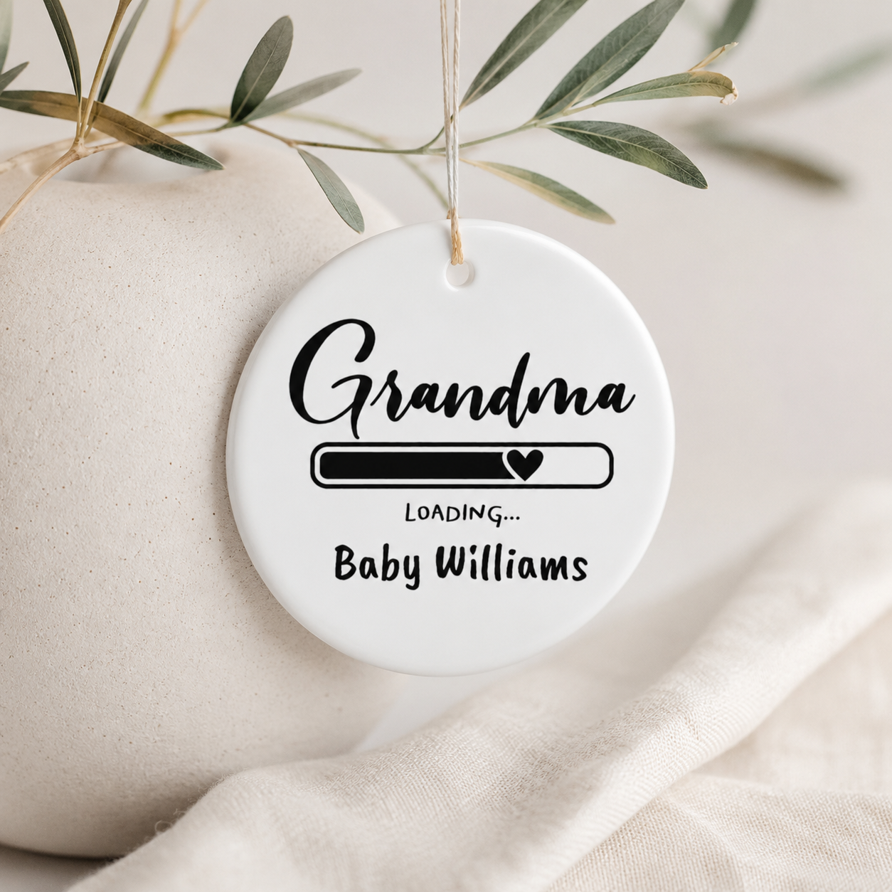Grandma Loading personalised ornament lifestyle shot — ceramic keepsake with gold hanging string