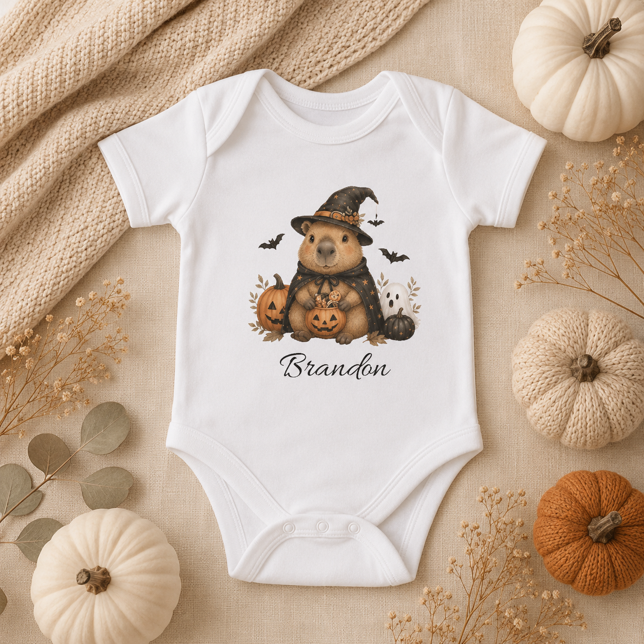 Halloween capybara witch bodysuit spec sheet — sizes NB to 24M personalised baby gift