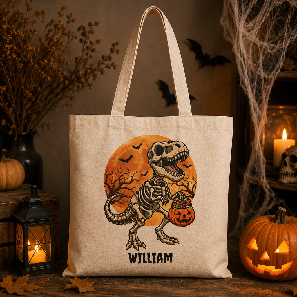 Skeleton dinosaur Halloween tote bag lifestyle — personalised cotton canvas boys trick or treat bag