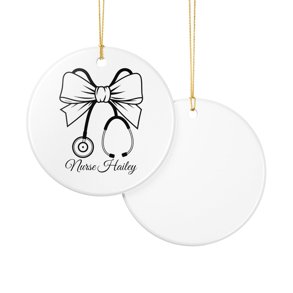Nurse stethoscope bow ornament lifestyle shot — round white ceramic nurse keepsake gift with gold string