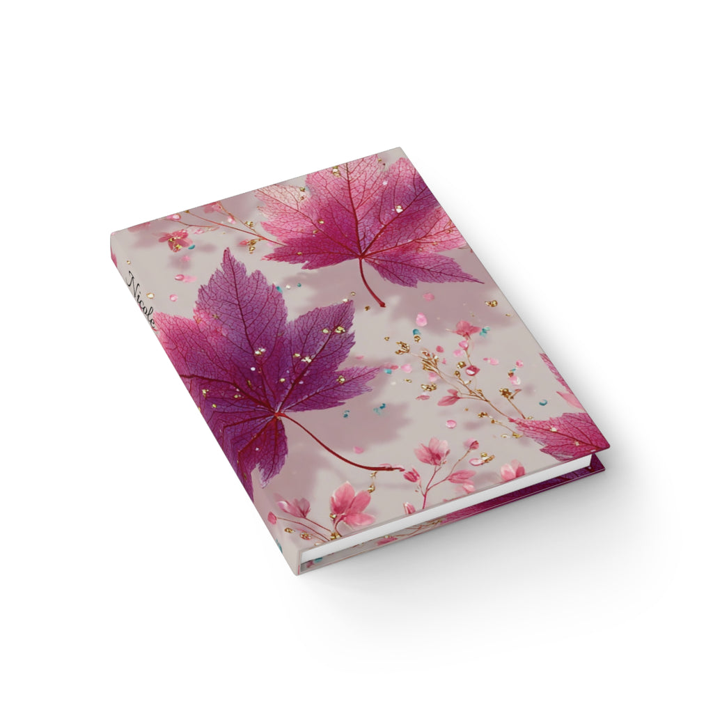 Botanical maple leaves journal lifestyle shot — personalised hardcover notebook with name on spine floral autumn design
